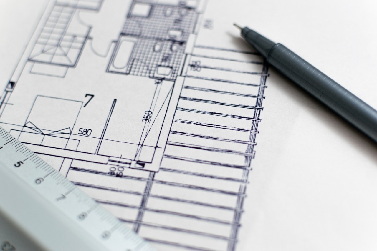 closeup blueprint with ruler and pen nearby