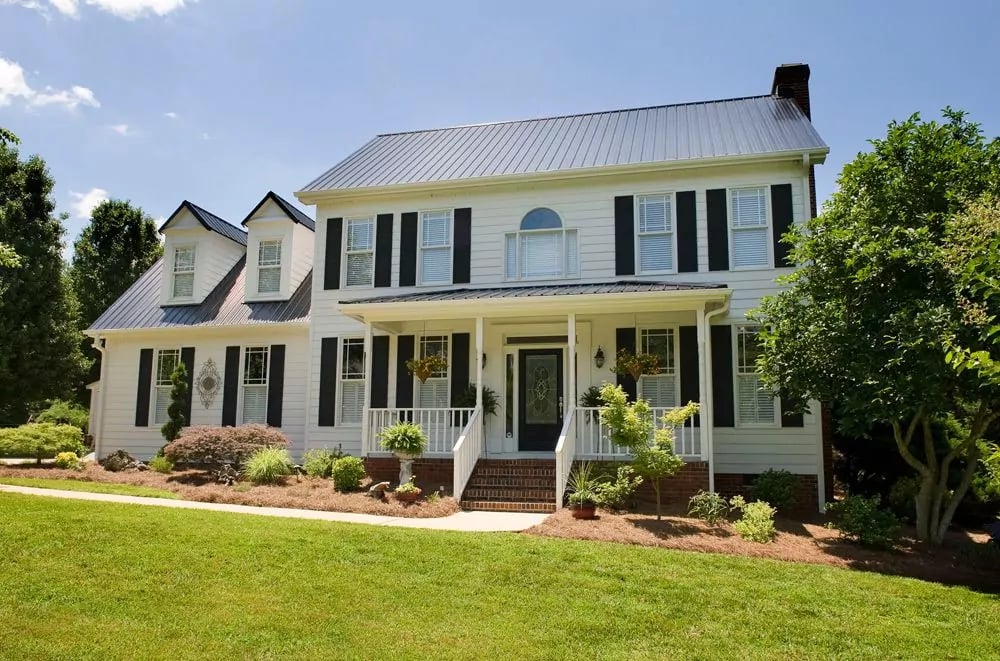 Black Metal Roof on White House